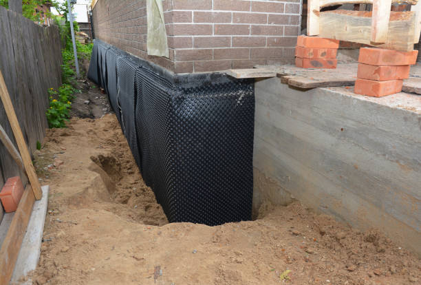 Happy homeowners after waterproofing job in Lorain